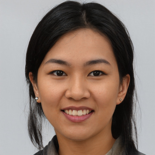 Joyful latino young-adult female with medium  black hair and brown eyes