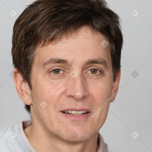 Joyful white adult male with short  brown hair and grey eyes