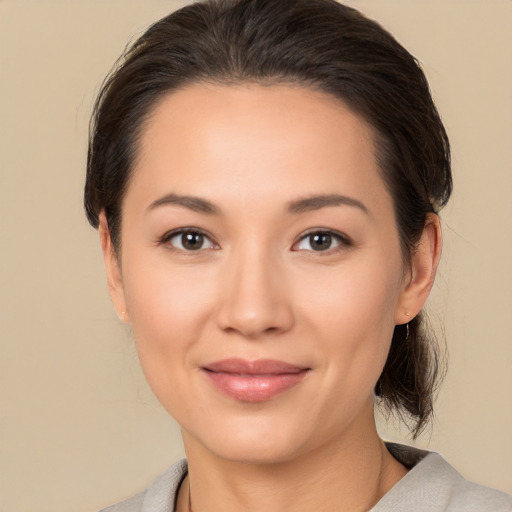 Joyful white young-adult female with medium  brown hair and brown eyes