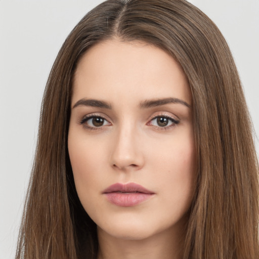 Neutral white young-adult female with long  brown hair and brown eyes