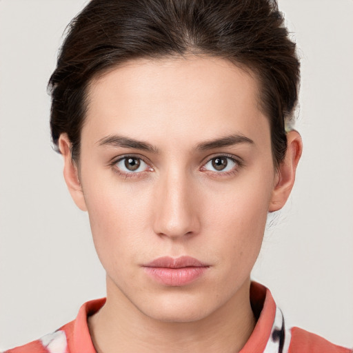 Neutral white young-adult female with short  brown hair and brown eyes