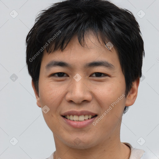 Joyful asian young-adult male with short  black hair and brown eyes