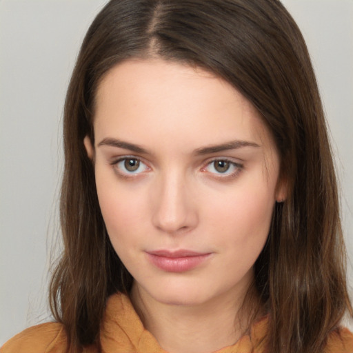 Neutral white young-adult female with long  brown hair and brown eyes