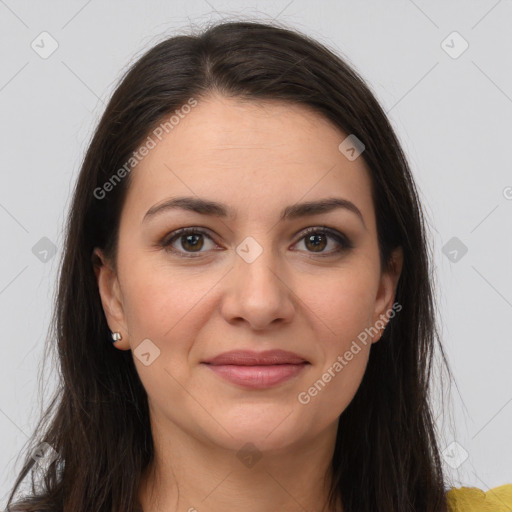 Joyful white young-adult female with long  brown hair and brown eyes