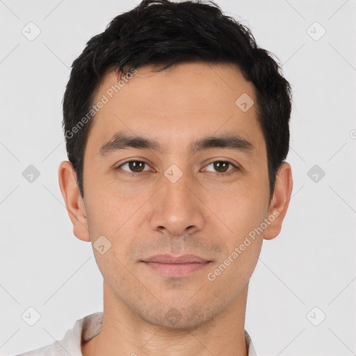 Joyful asian young-adult male with short  black hair and brown eyes