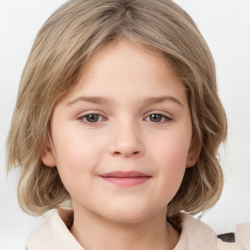 Joyful white child female with medium  brown hair and grey eyes