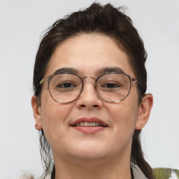 Joyful white adult female with short  brown hair and brown eyes