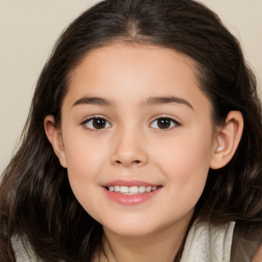 Joyful white child female with long  brown hair and brown eyes