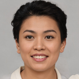 Joyful asian young-adult female with short  brown hair and brown eyes