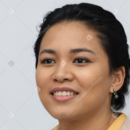 Joyful asian young-adult female with short  black hair and brown eyes