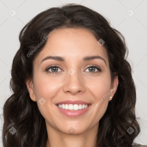 Joyful white young-adult female with long  brown hair and brown eyes