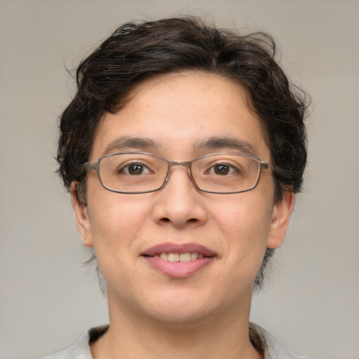 Joyful white adult male with medium  brown hair and brown eyes