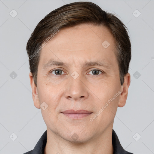 Joyful white adult male with short  brown hair and brown eyes