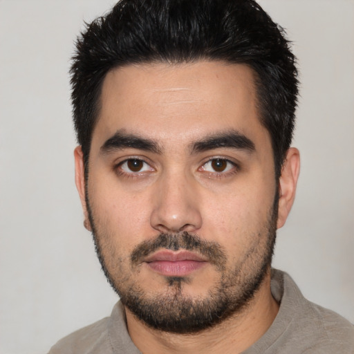 Neutral white young-adult male with short  black hair and brown eyes