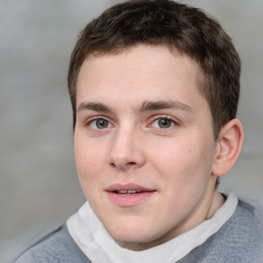 Joyful white young-adult male with short  brown hair and blue eyes