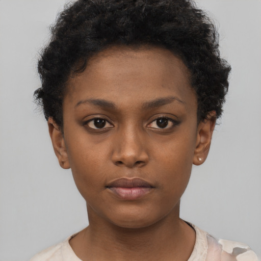 Neutral black child female with short  brown hair and brown eyes