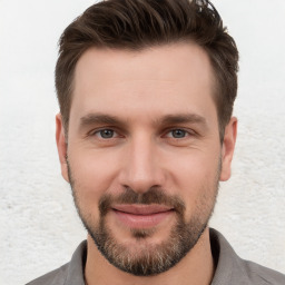 Joyful white young-adult male with short  brown hair and brown eyes