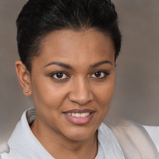 Joyful black young-adult female with short  brown hair and brown eyes