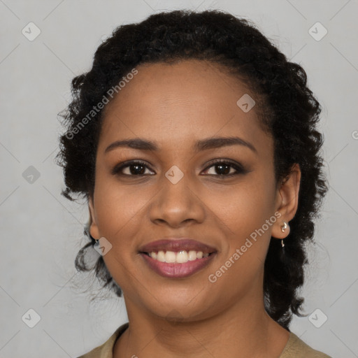 Joyful black young-adult female with medium  brown hair and brown eyes