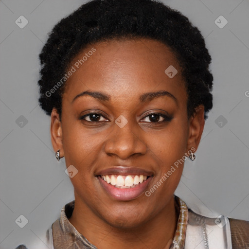 Joyful black young-adult female with short  black hair and brown eyes