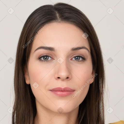 Neutral white young-adult female with long  brown hair and brown eyes