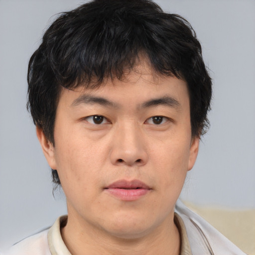 Neutral asian young-adult male with short  brown hair and brown eyes