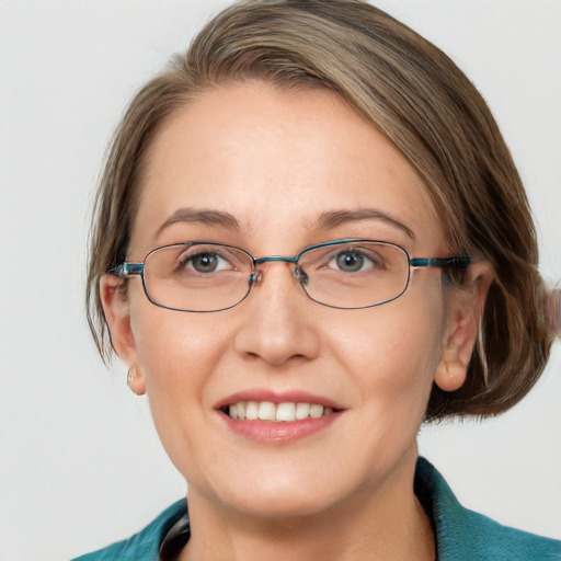 Joyful white adult female with medium  brown hair and blue eyes