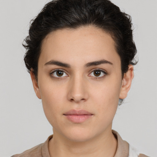 Neutral white young-adult female with short  brown hair and brown eyes