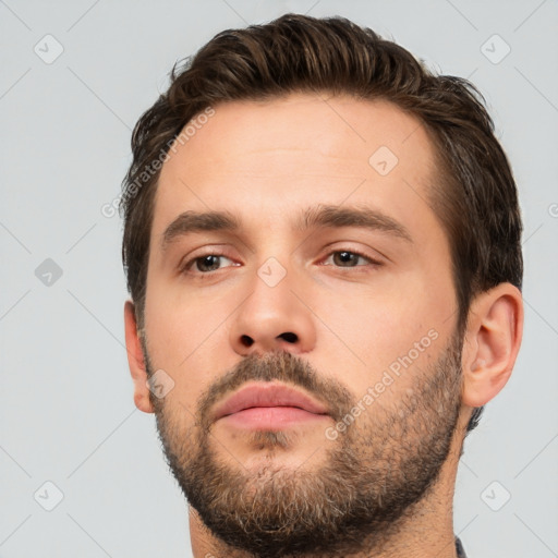 Neutral white young-adult male with short  brown hair and brown eyes