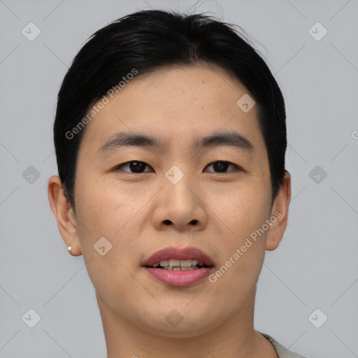 Joyful asian young-adult male with short  brown hair and brown eyes