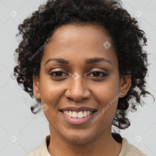 Joyful black young-adult female with medium  brown hair and brown eyes