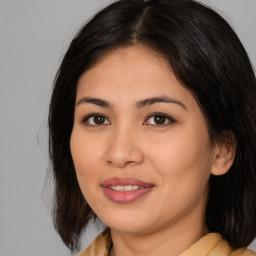 Joyful asian young-adult female with medium  brown hair and brown eyes