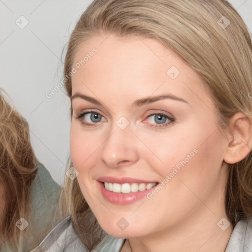 Joyful white young-adult female with medium  brown hair and blue eyes