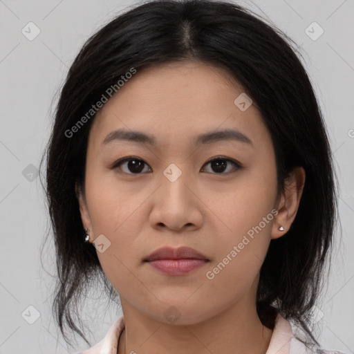 Joyful asian young-adult female with medium  black hair and brown eyes