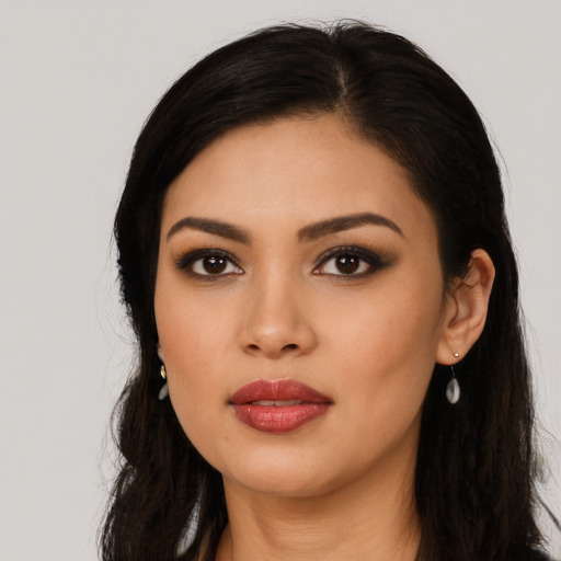 Neutral latino young-adult female with long  black hair and brown eyes