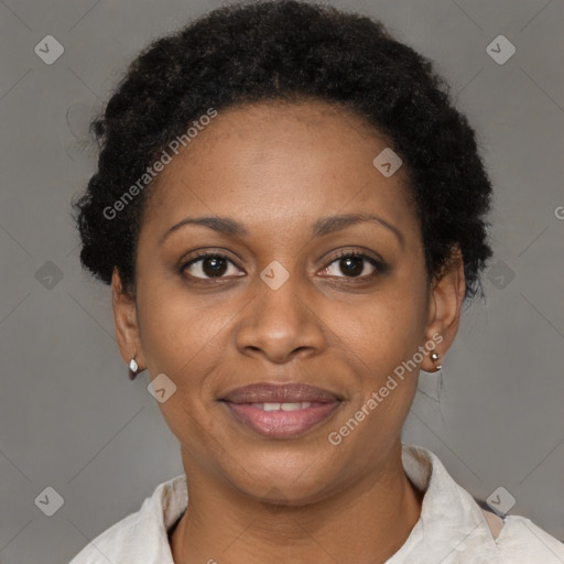 Joyful black adult female with short  brown hair and brown eyes