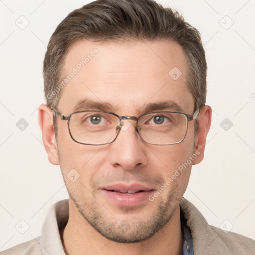 Joyful white adult male with short  brown hair and brown eyes