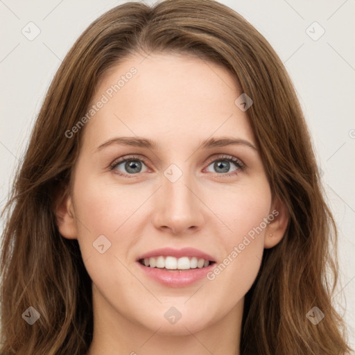 Joyful white young-adult female with long  brown hair and green eyes