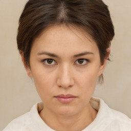 Neutral white young-adult female with short  brown hair and brown eyes