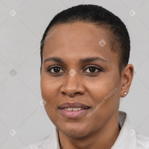 Joyful black young-adult female with short  black hair and brown eyes