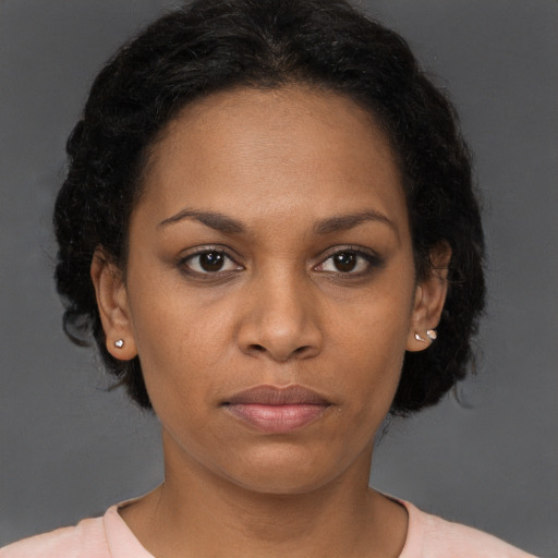 Neutral black young-adult female with short  brown hair and brown eyes