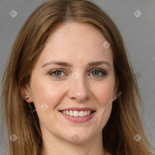 Joyful white adult female with long  brown hair and grey eyes