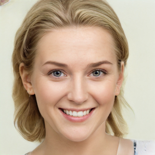 Joyful white young-adult female with medium  brown hair and blue eyes