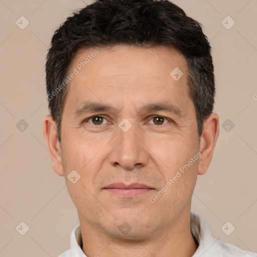 Joyful white adult male with short  brown hair and brown eyes