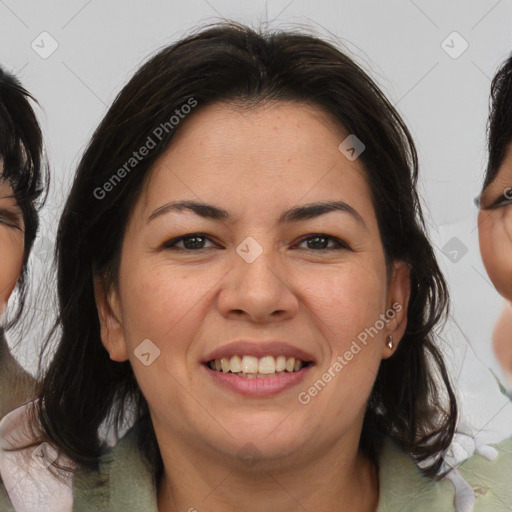 Joyful asian adult female with medium  brown hair and brown eyes