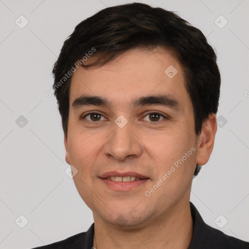 Joyful white young-adult male with short  black hair and brown eyes