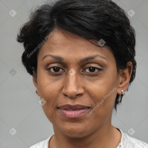 Joyful latino adult female with short  brown hair and brown eyes