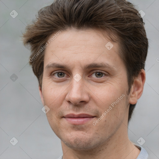 Joyful white adult male with short  brown hair and grey eyes