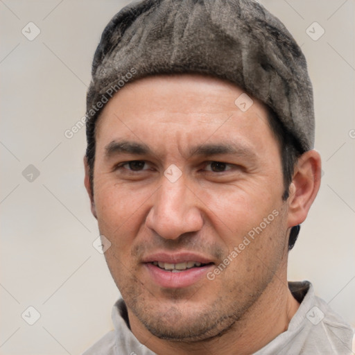 Joyful white adult male with short  black hair and brown eyes