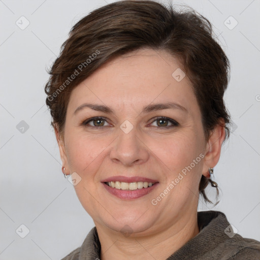 Joyful white adult female with medium  brown hair and grey eyes